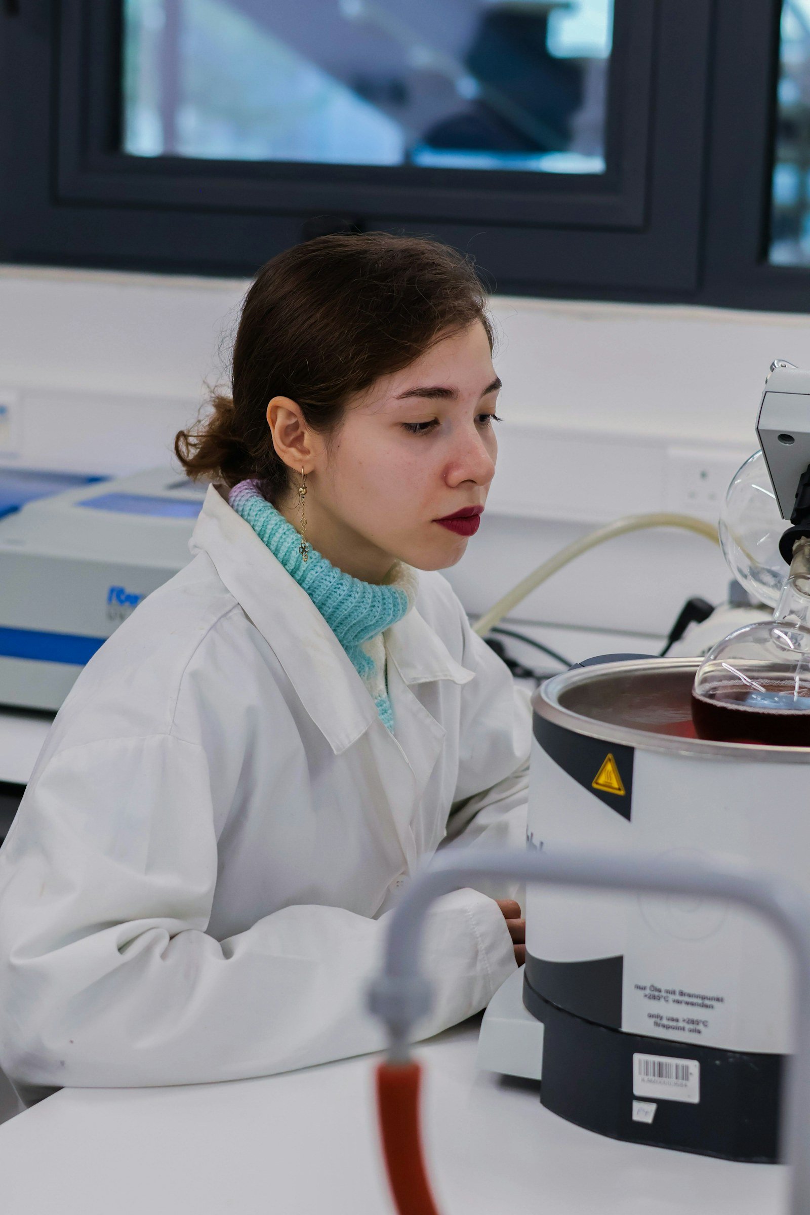 Chemist working with laboratory equipment